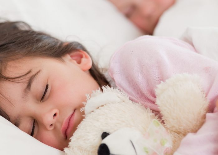 Portrait of calm children sleeping in a bedroom